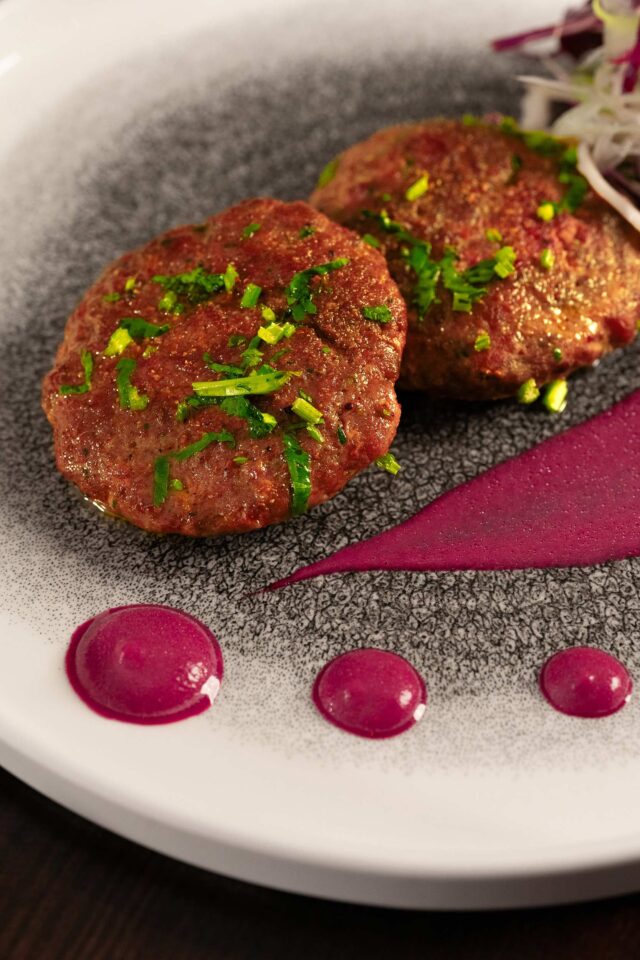 Freshly prepared Galouti Kebab with beetroot chutney.