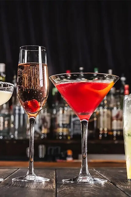 Handcrafted signature brunch mocktails and colorful cocktails lined up at the bar.
