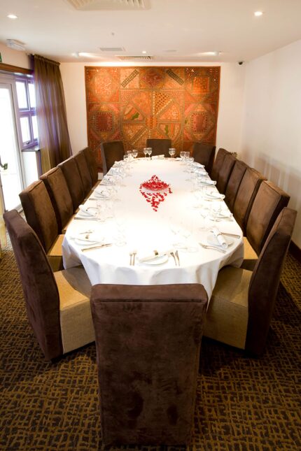 Beautifully decorated long-table banqueting arrangements for wedding parties.