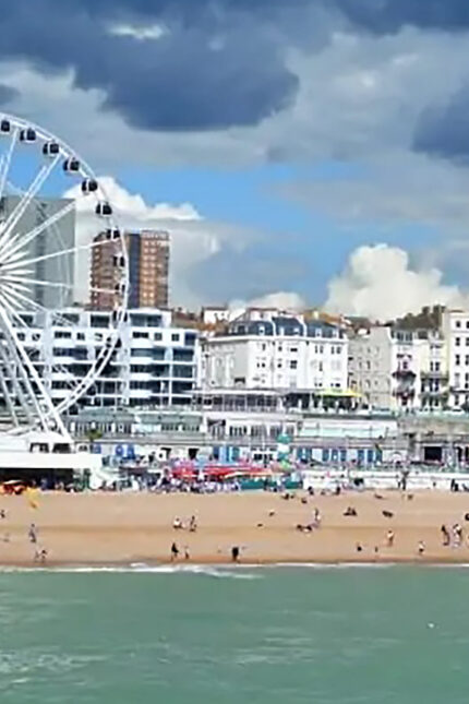 Brighton beach and Ferris wheel on a sunny May Bank Holiday near Zari Restaurant Crawley.