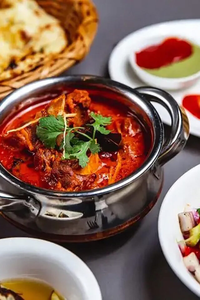 Gourmet Bengali fish curry main course served fresh at Zari Indian restaurant.