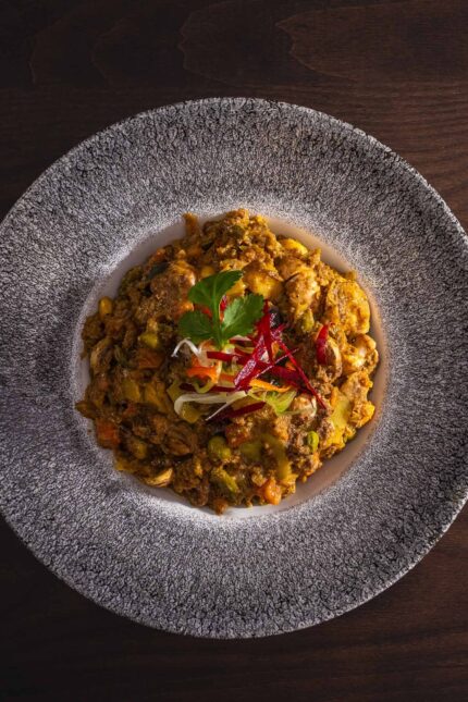 Gourmet traditional Indian mince dish featuring fresh herbs served at Zari Crawley.