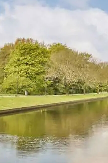 Scenic lake and green trees at Tilgate Park in Crawley during May Bank Holiday.