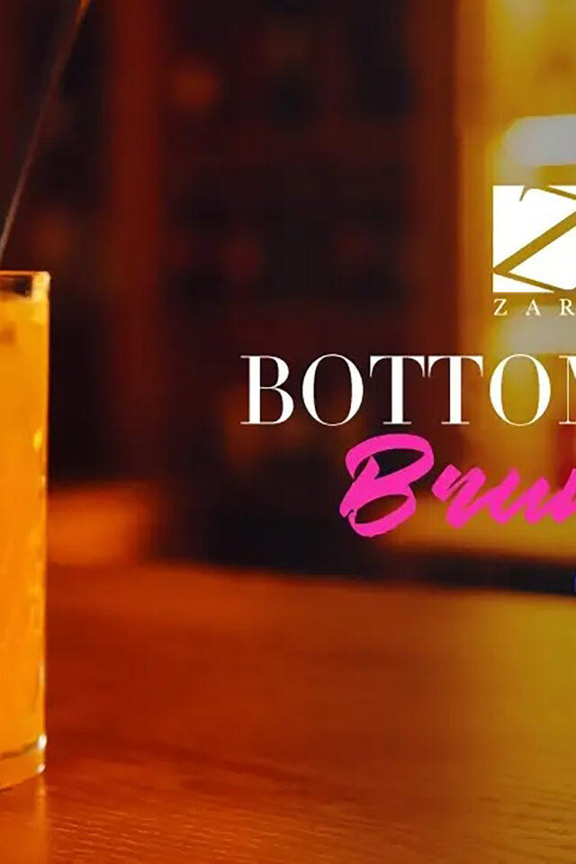 Refreshing brunch cocktail with lavender garnish at Zari Indian restaurant.