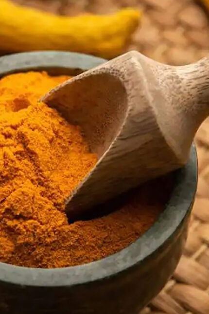 Aromatic ground turmeric powder and colorful spices at Zari Indian restaurant in Crawley.