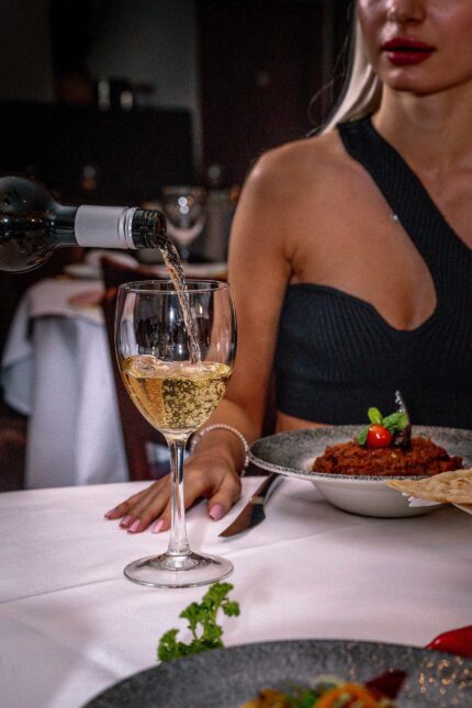 Premium wine service pairing with authentic regional Indian dishes at Zari Crawley.